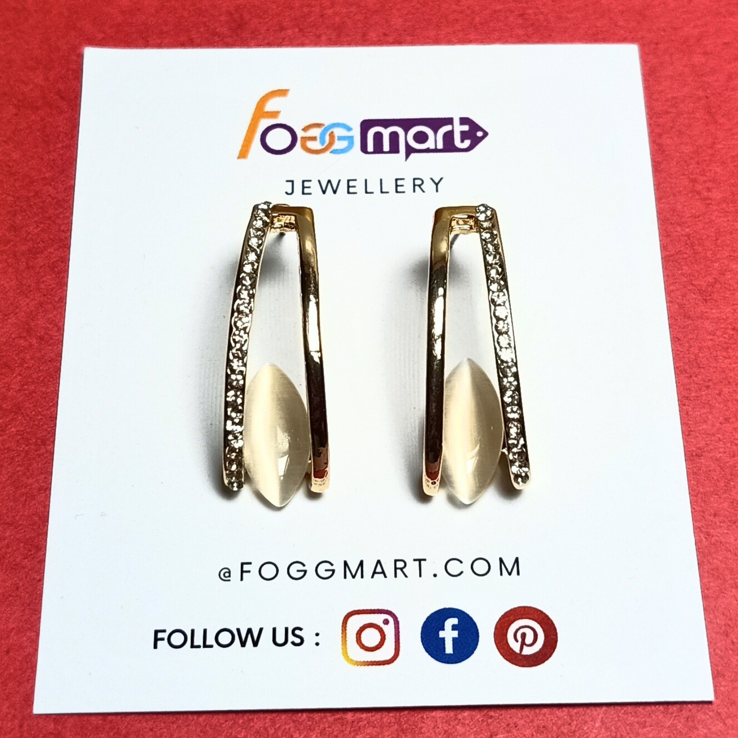 Gold hoop earrings on a Foggmart Jewellery card with brand logo and website information.