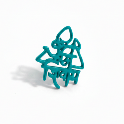 Turquoise metal spider-shaped object on a white background