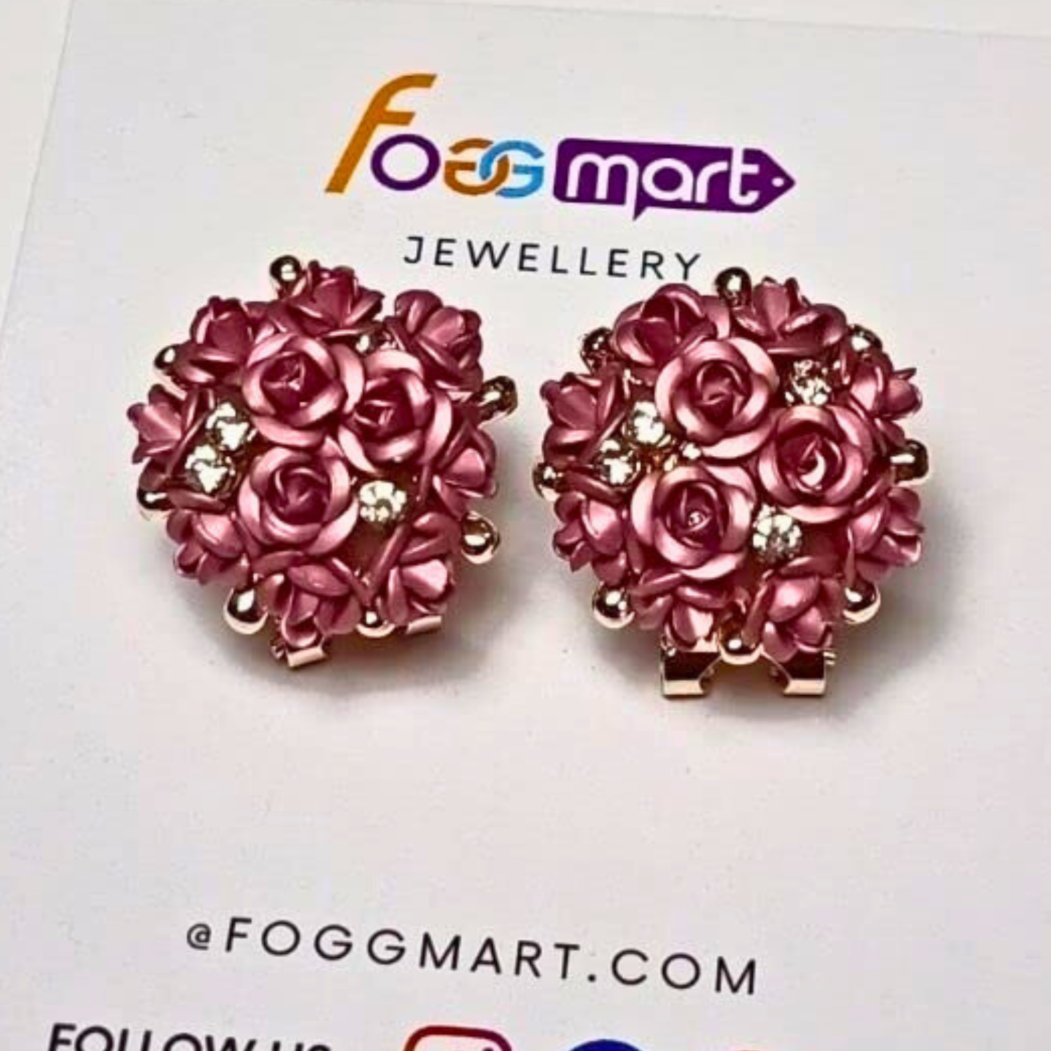 Pink rose-shaped earrings on a Foggmart Jewellery card.