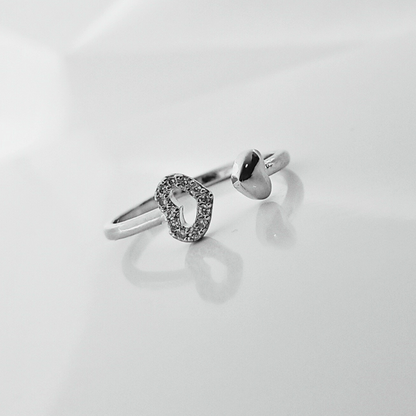 Silver ring with a unique design on a light gray background