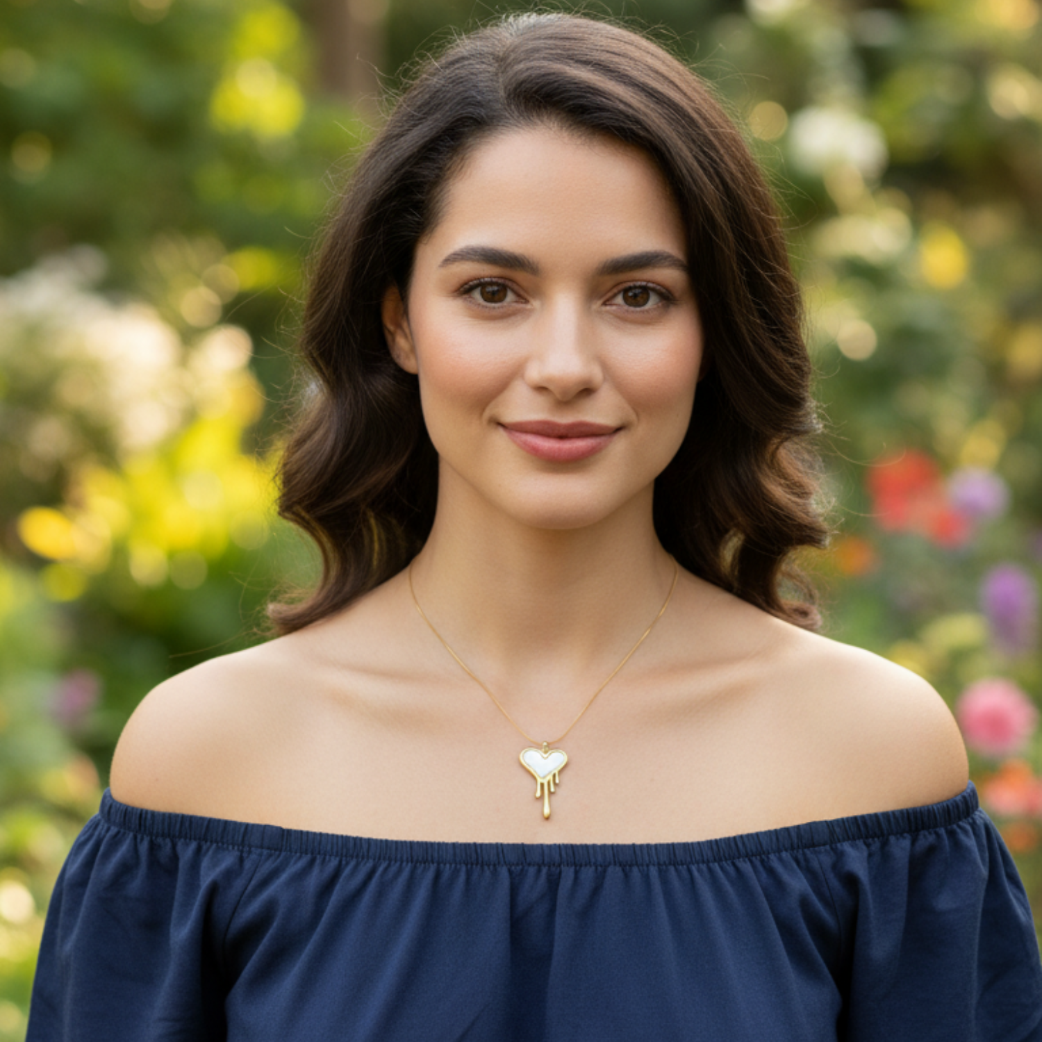 Woman wearing a blue off-shoulder top with a blurred natural background