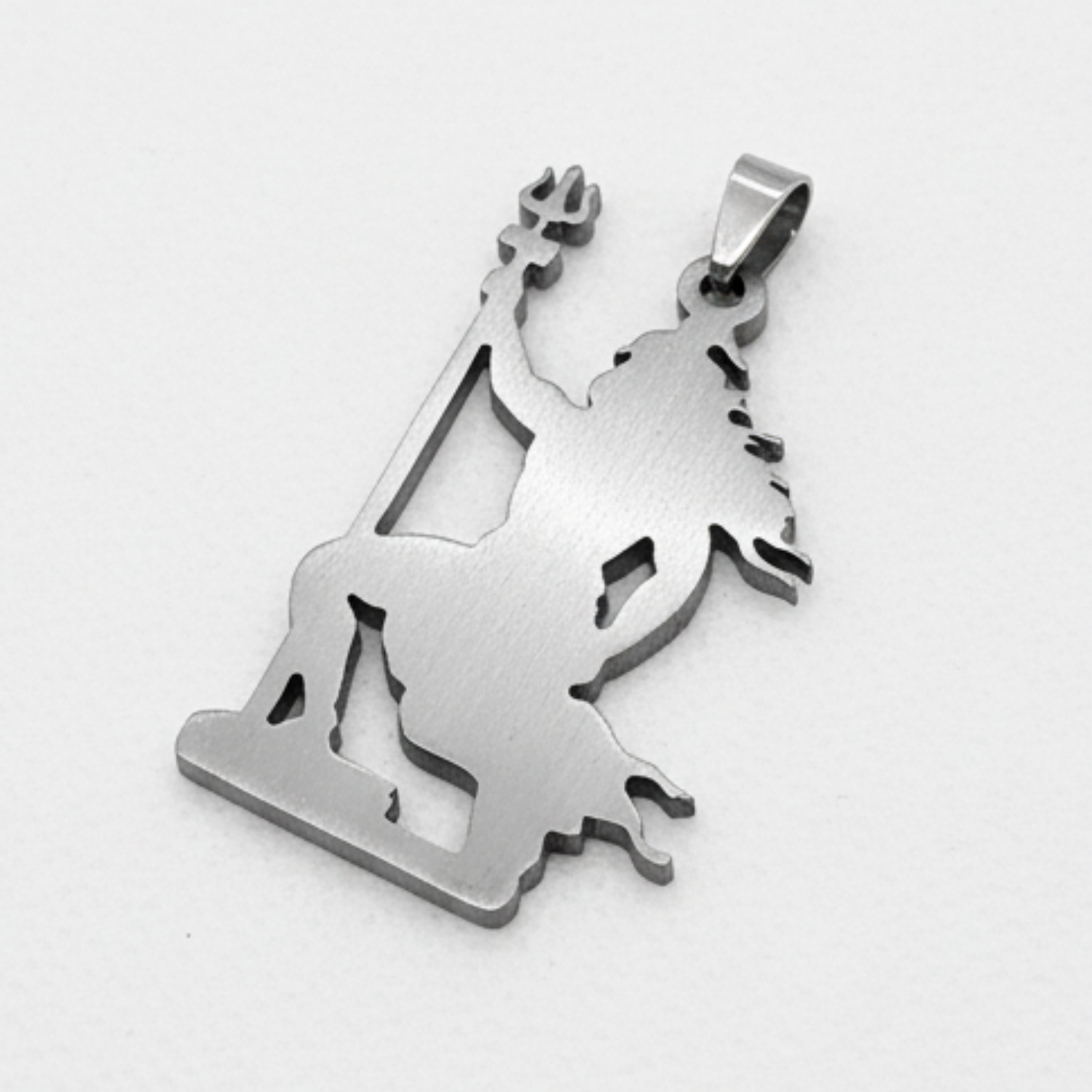 Silver pendant of a shiv or trishul on a white background