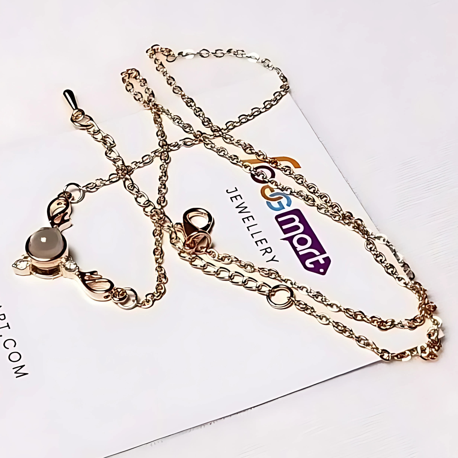 Gold chain necklace on a white card with 'Jewellery Foggmart' branding.