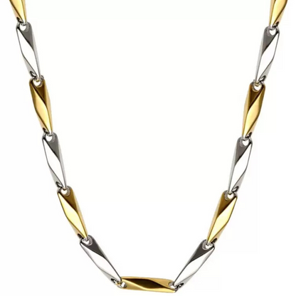 Two-tone gold and silver necklace on a white background