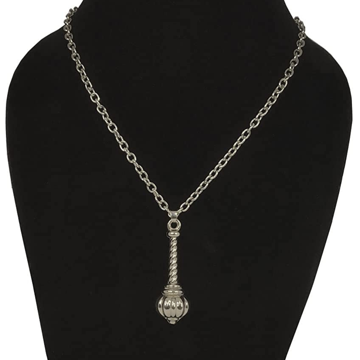 Silver necklace with a pendant on a black mannequin bust