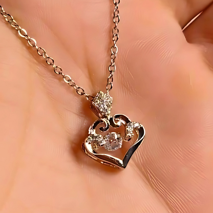 Rose gold heart-shaped necklace with diamond accents on a soft peach background