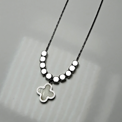 Necklace with a butterfly pendant on a gray background