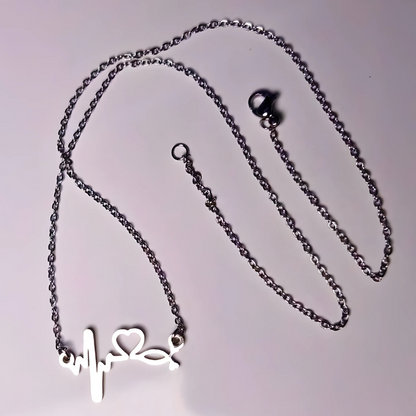 Necklace with a heart-shaped pendant on a light gray background