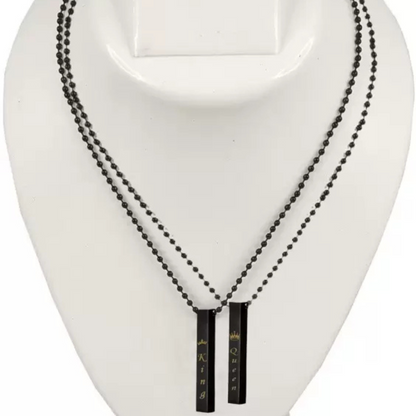 Black beaded necklace with pendant on a white mannequin bust