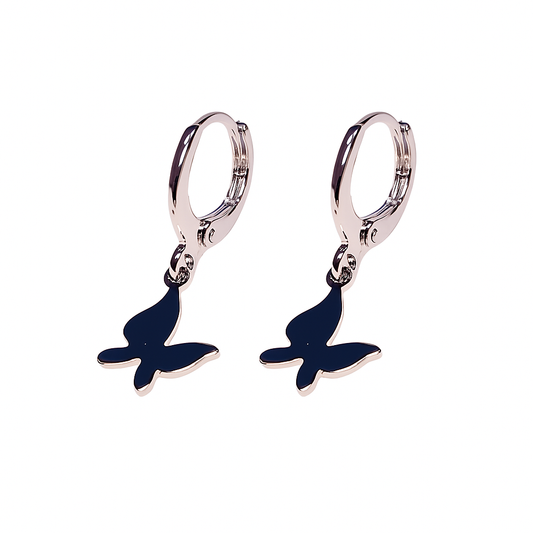 Pair of silver hoop earrings with blue butterfly charms on a white background